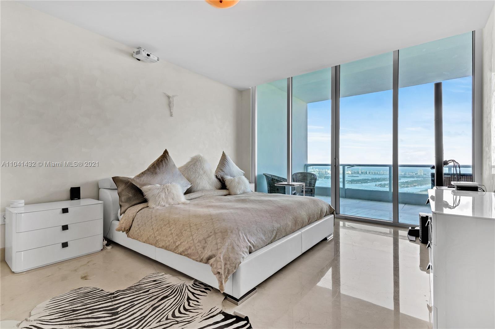 900 Biscayne Boulevard, Unit 6301 Miami, FL 33132 - Photo 44 of 72 a bedroom with a bed and large window