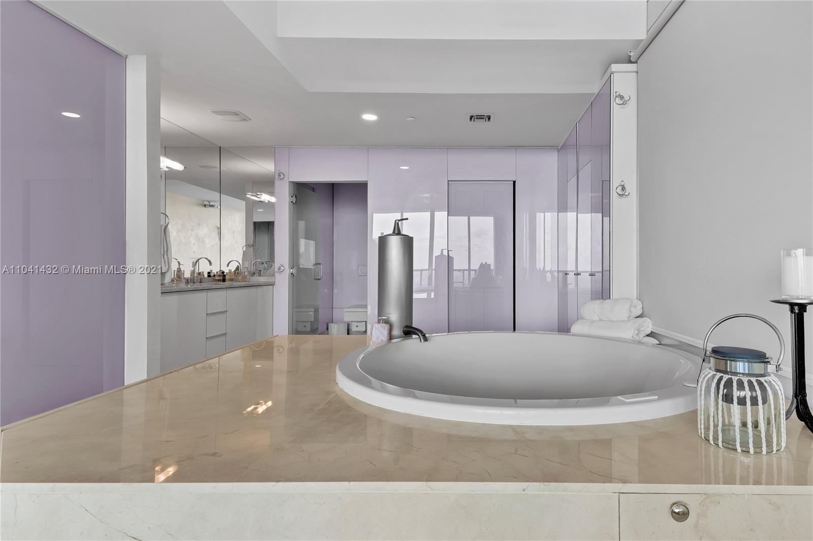 900 Biscayne Boulevard, Unit 6301 Miami, FL 33132 - Photo 47 of 72 a spacious bathroom with a tub a sink and a mirror