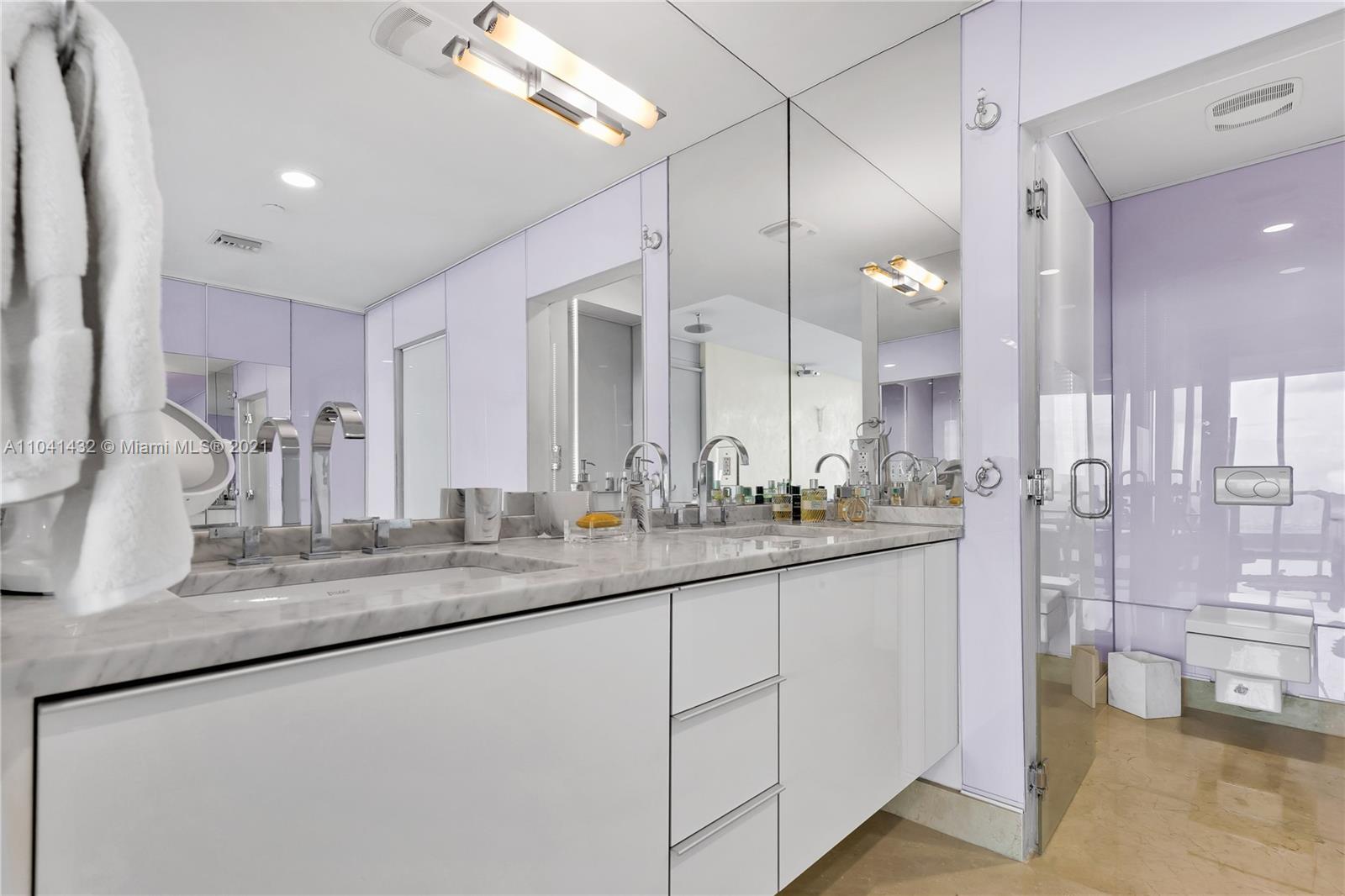 900 Biscayne Boulevard, Unit 6301 Miami, FL 33132 - Photo 50 of 72 a bathroom with sink and mirror