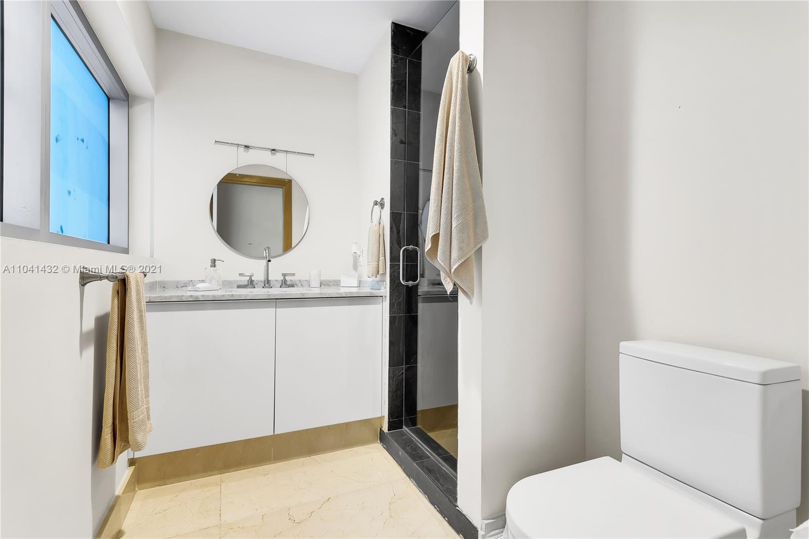 900 Biscayne Boulevard, Unit 6301 Miami, FL 33132 - Photo 55 of 72 a bathroom with a granite countertop sink toilet and shower