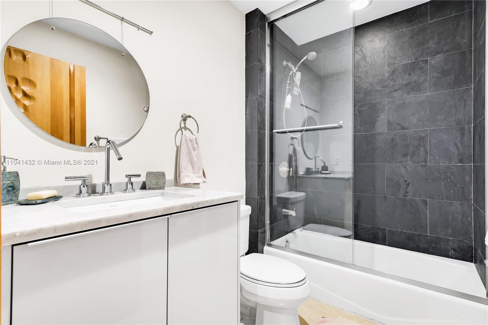 900 Biscayne Boulevard, Unit 6301 Miami, FL 33132 - Photo 58 of 72 a bathroom with a sink a toilet and shower