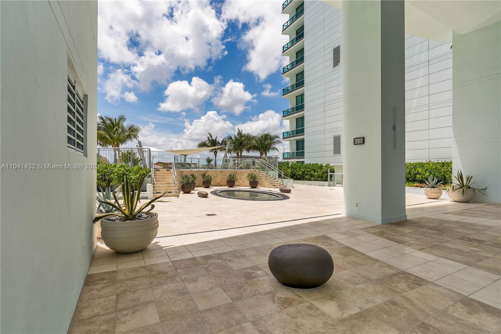 900 Biscayne Boulevard, Unit 6301 Miami, FL 33132 - Photo 7 of 72 a view of a terrace with lawn chairs and potted plants