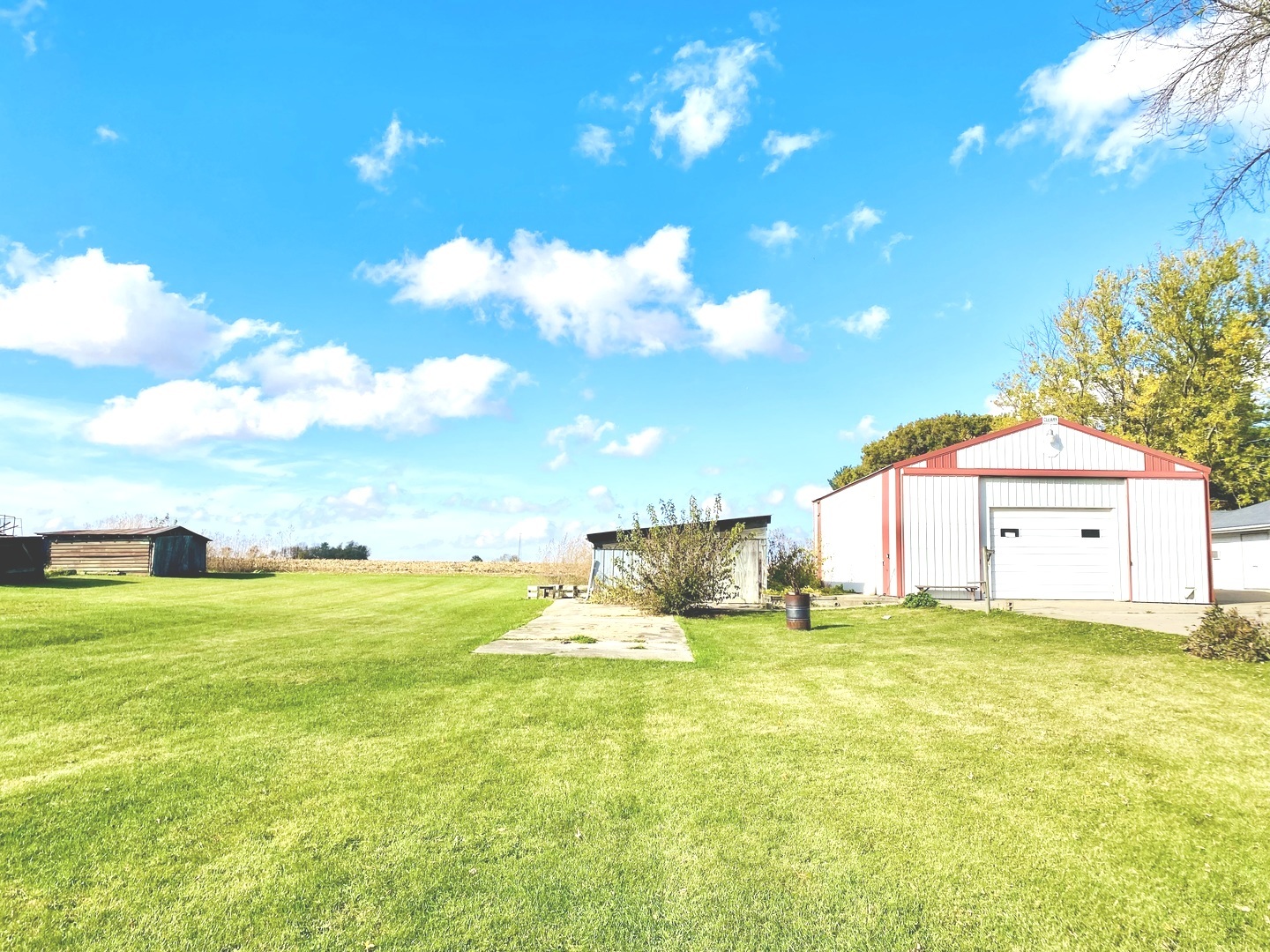 210 South 1st Street Holcomb, IL 61043 - Photo 11 of 15 a view of a house with a yard and basketball court