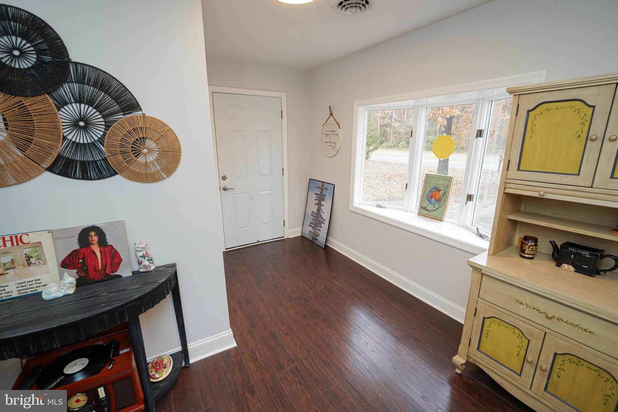 3493 Meadow Bridge Road Eden, MD 21822 - Photo 17 of 36 a view of a dining room with wooden floor and window
