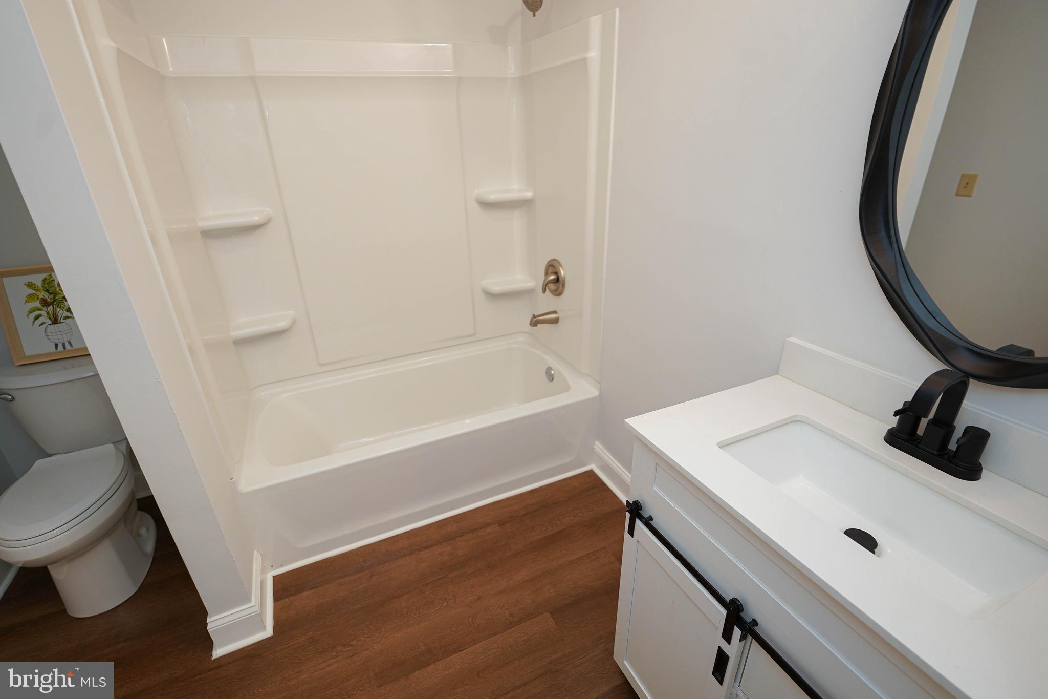 3493 Meadow Bridge Road Eden, MD 21822 - Photo 31 of 36 a bathroom with a sink and a mirror