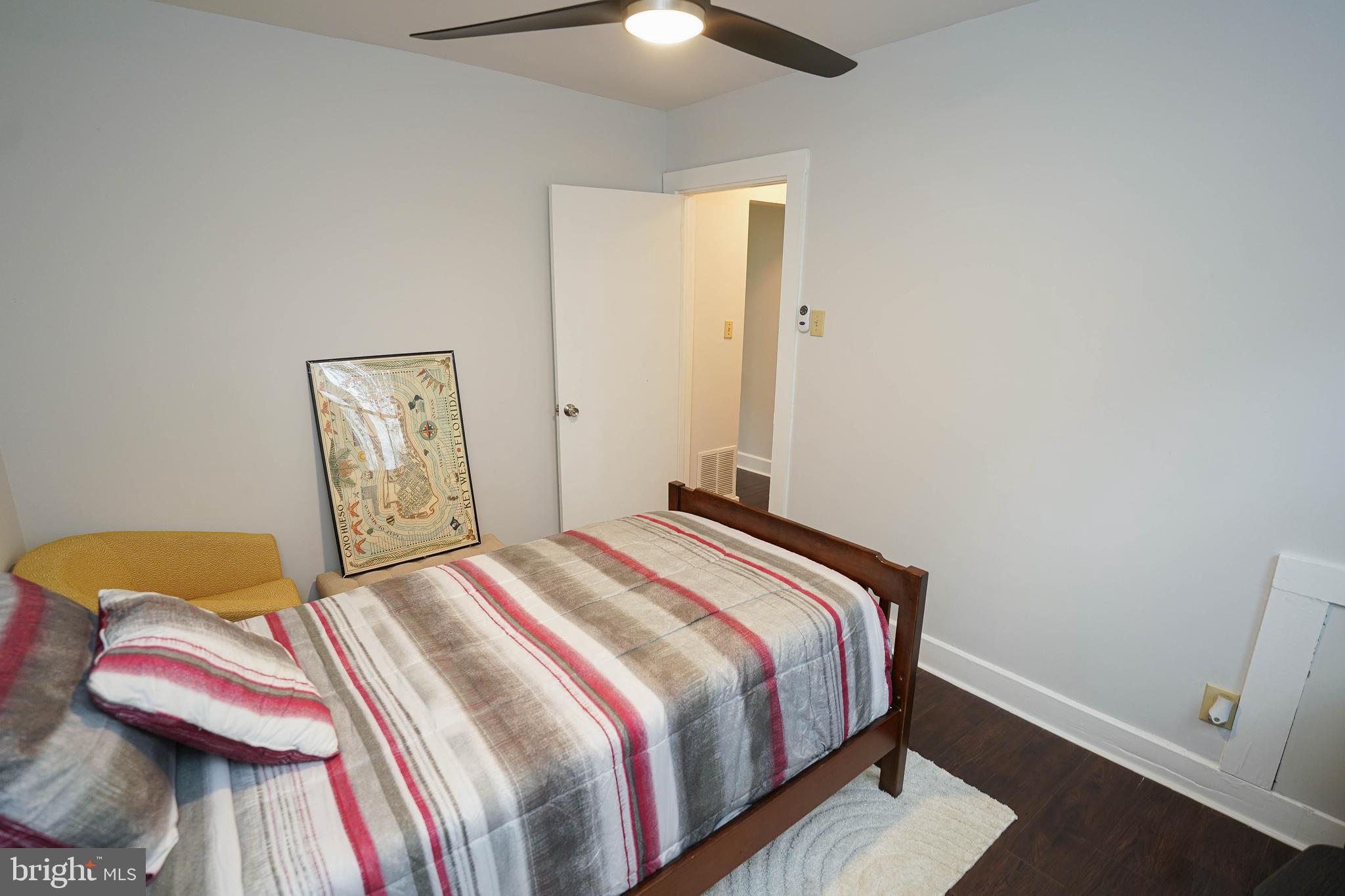 3493 Meadow Bridge Road Eden, MD 21822 - Photo 35 of 36 a bedroom with a bed and a lamp