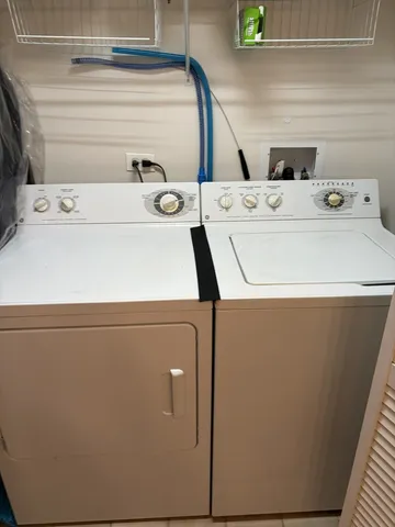 a utility room with dryer and washer