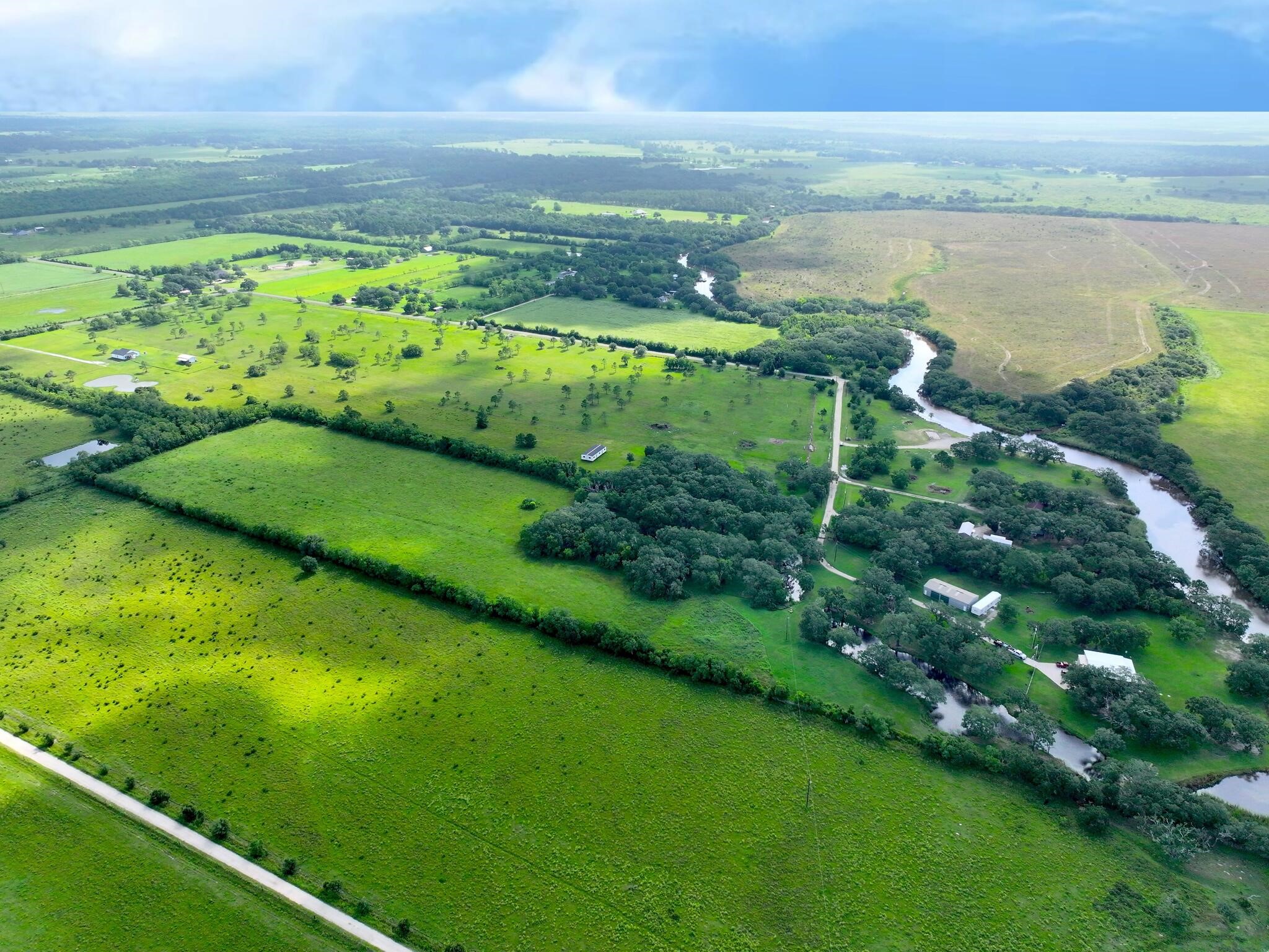1734 Haynes Road Anahuac, TX 77514 - Photo 15 of 23 a view of a lake with a big yard