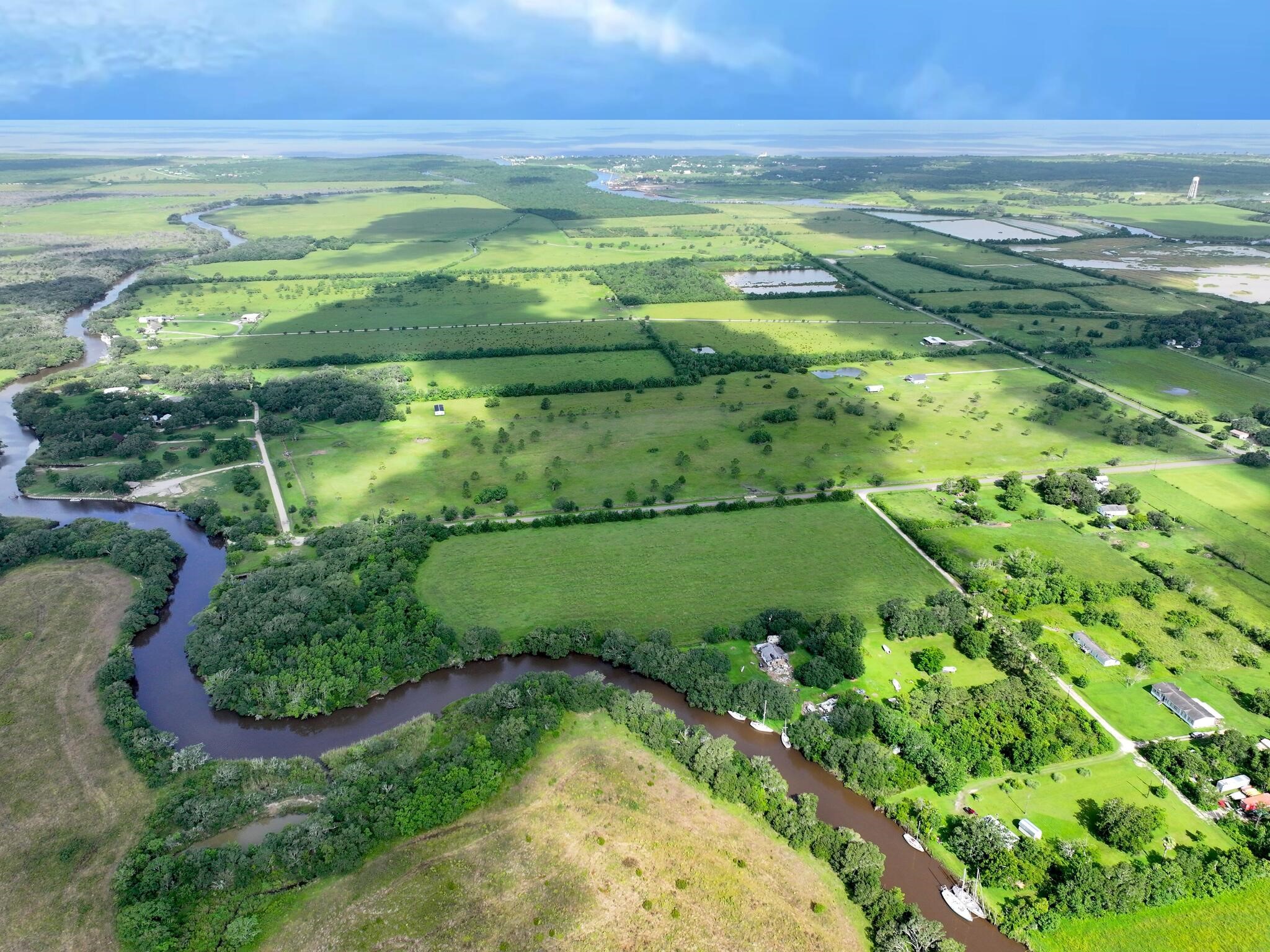 1734 Haynes Road Anahuac, TX 77514 - Photo 7 of 23 a view of a field with an ocean
