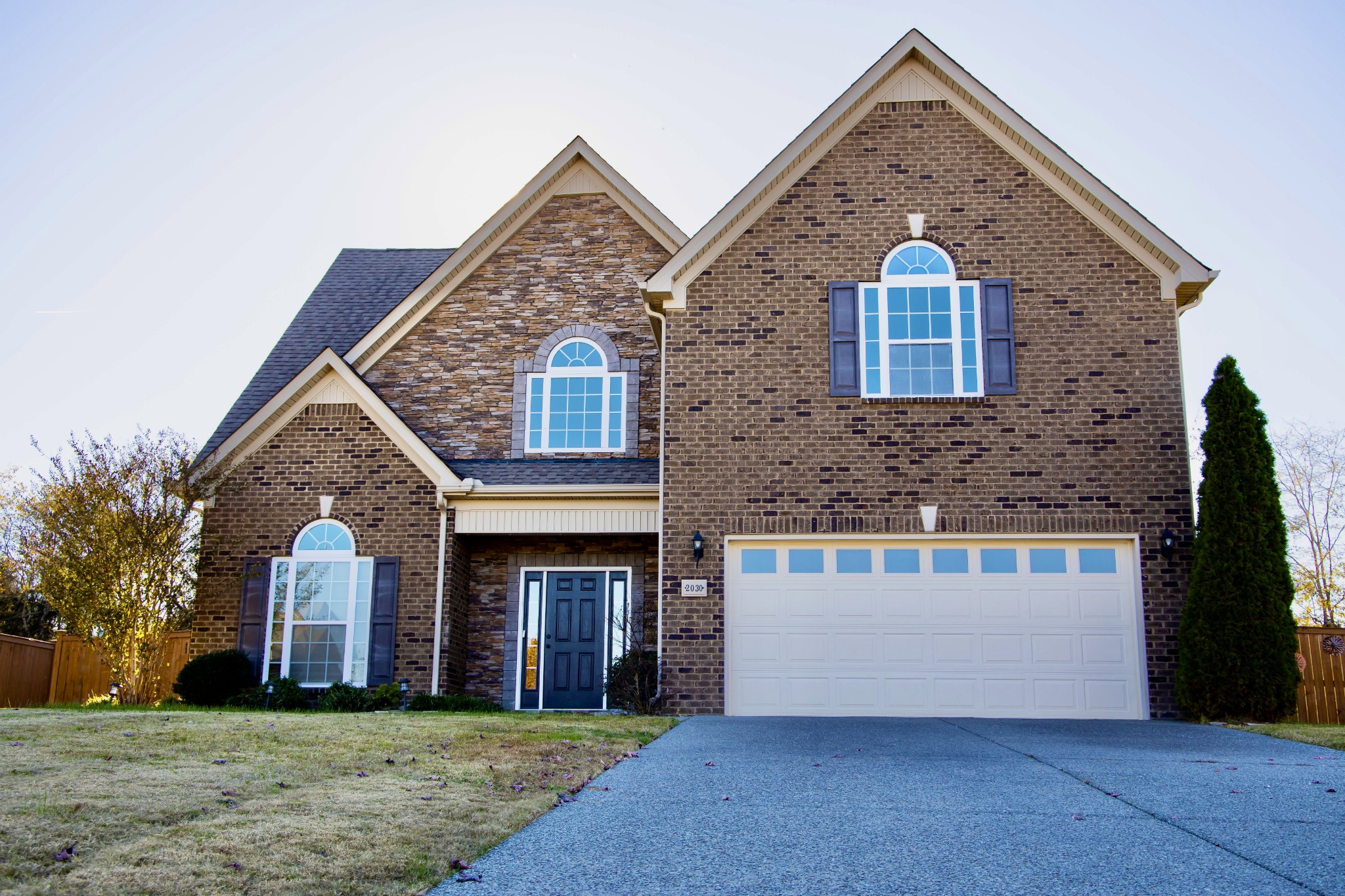 2030 Lincoln Road Spring Hill, TN 37174 - Photo 1 of 29 a front view of a house with a yard