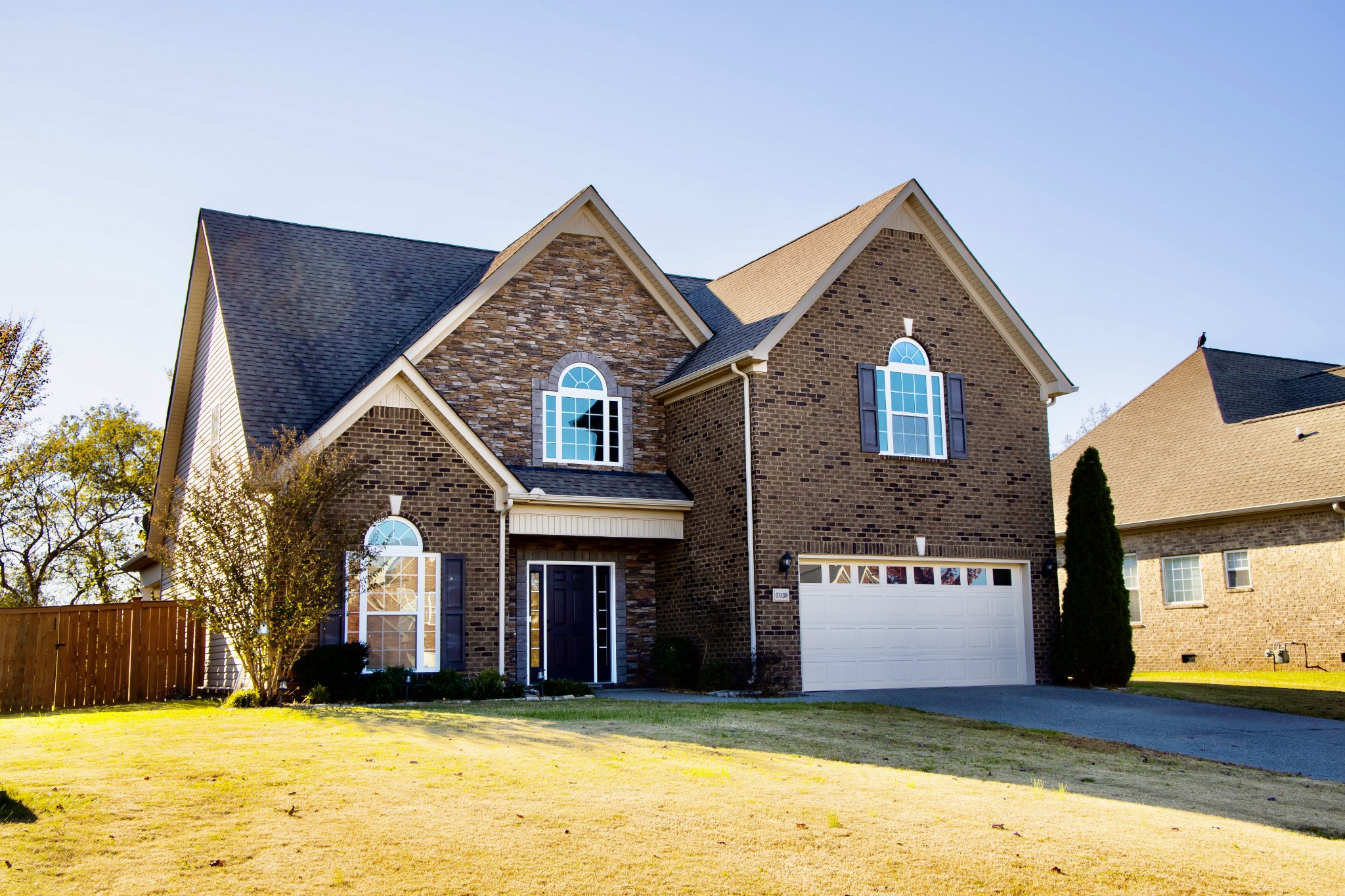 2030 Lincoln Road Spring Hill, TN 37174 - Photo 2 of 29 a front view of a house with a yard