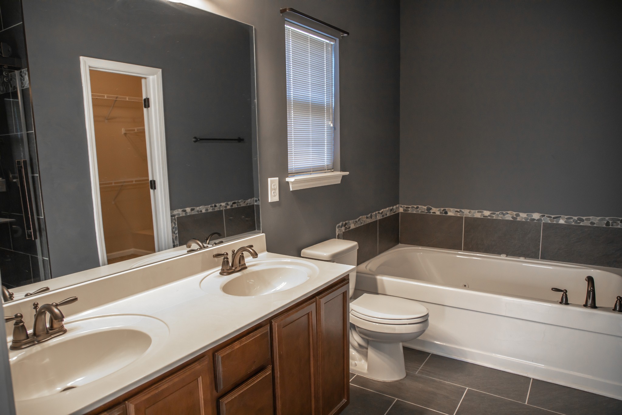 2030 Lincoln Road Spring Hill, TN 37174 - Photo 15 of 29 a bathroom with a sink a toilet and bathtub