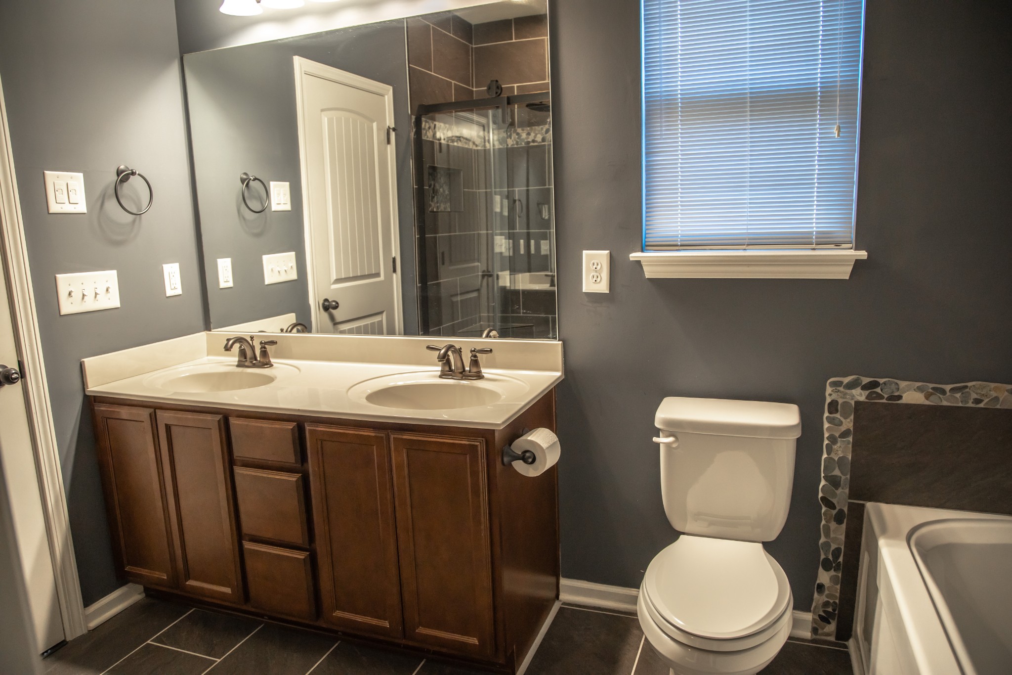 2030 Lincoln Road Spring Hill, TN 37174 - Photo 16 of 29 a bathroom with a toilet sink and mirror