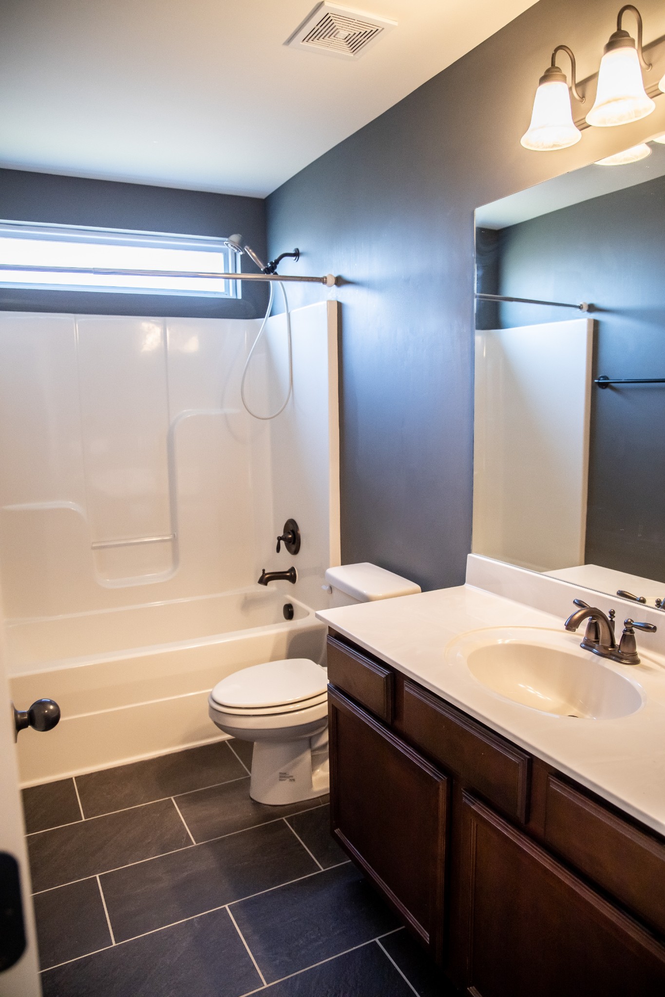 2030 Lincoln Road Spring Hill, TN 37174 - Photo 23 of 29 a bathroom with a sink a toilet and shower