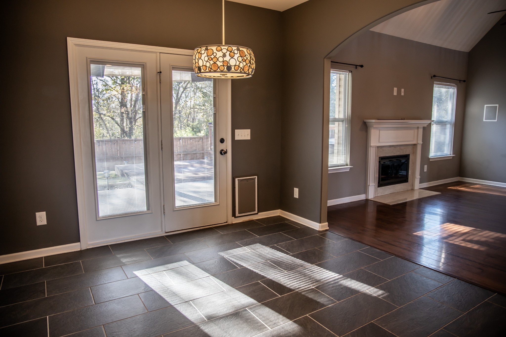 2030 Lincoln Road Spring Hill, TN 37174 - Photo 8 of 29 a view of an empty room with wooden floor and a fireplace