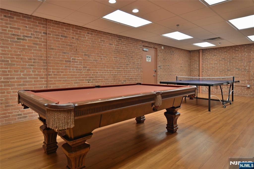4201 Rio Vista Drive, Unit 4201 Mahwah, NJ 07430 - Photo 29 of 34 a room with wooden floor and pool table