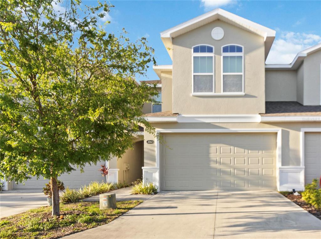 a front view of a house with a yard