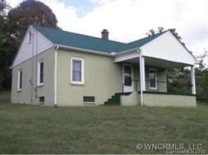 504 Barnard Road Marshall, NC 28753 - Photo 1 of 12 a front view of a house with garden