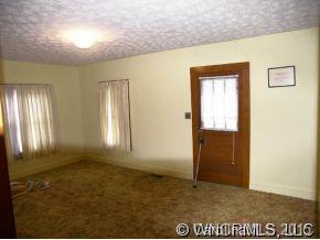 504 Barnard Road Marshall, NC 28753 - Photo 2 of 12 an empty room with windows
