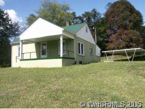 504 Barnard Road Marshall, NC 28753 - Photo 11 of 12 a view of house with backyard and garden