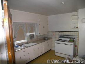 504 Barnard Road Marshall, NC 28753 - Photo 3 of 12 a kitchen with granite countertop a stove and a sink