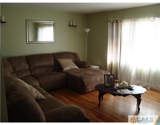 8 Yale Road Old Bridge, NJ 08859 - Photo 3 of 14 a bedroom with a bed couch and window
