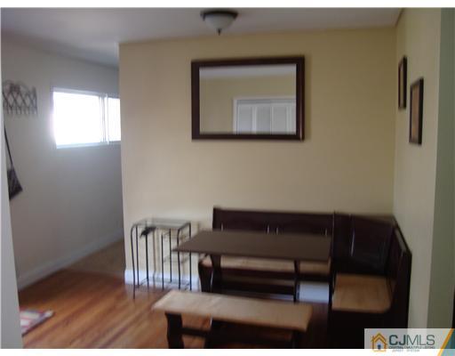 8 Yale Road Old Bridge, NJ 08859 - Photo 4 of 14 a living room with furniture a window and a wooden floor