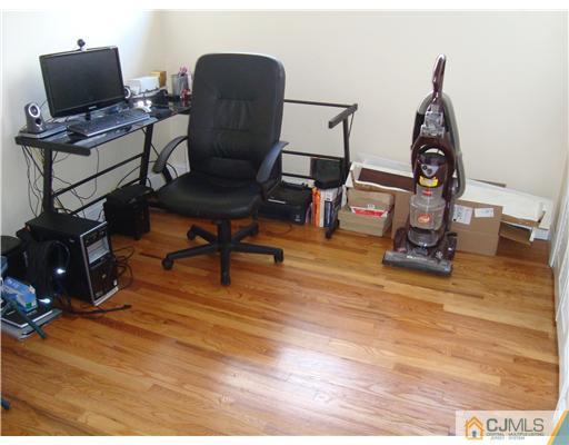 8 Yale Road Old Bridge, NJ 08859 - Photo 5 of 14 a view of a workspace with furniture and wooden floor