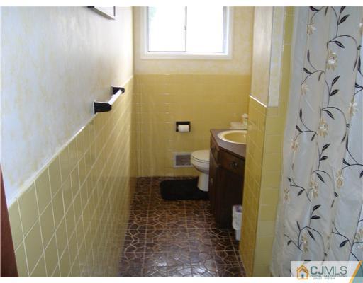 8 Yale Road Old Bridge, NJ 08859 - Photo 8 of 14 a bathroom with a sink and toilet