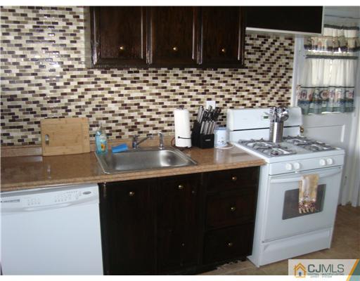 8 Yale Road Old Bridge, NJ 08859 - Photo 10 of 14 a kitchen with a sink and cabinets