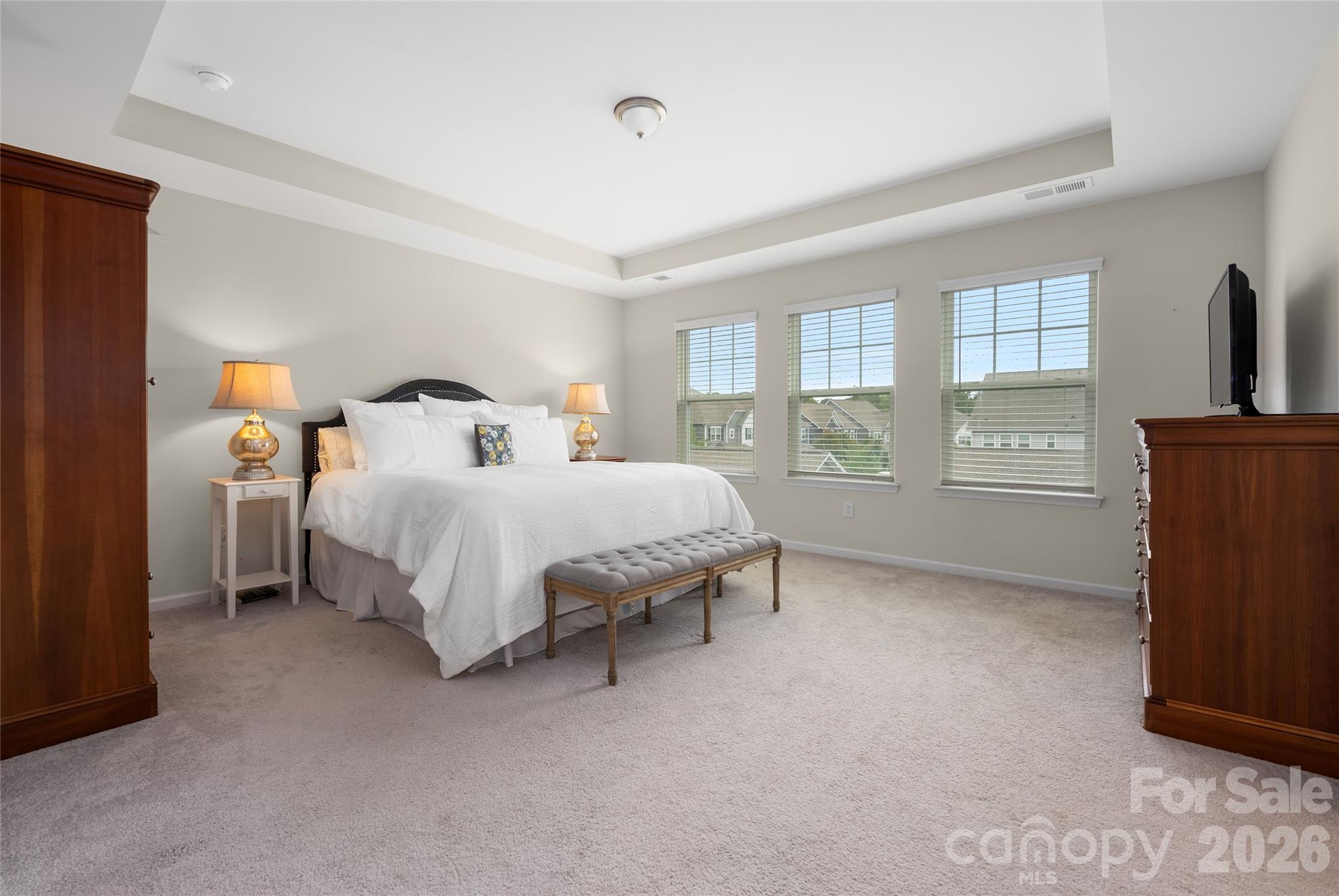 17219 Shearer Road Davidson, NC 28036 - Photo 17 of 34 a bed sitting in a bedroom next to a window