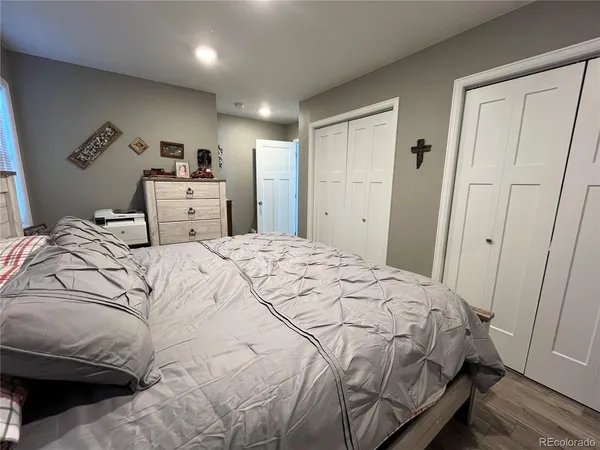 a bedroom with a bed and a closet