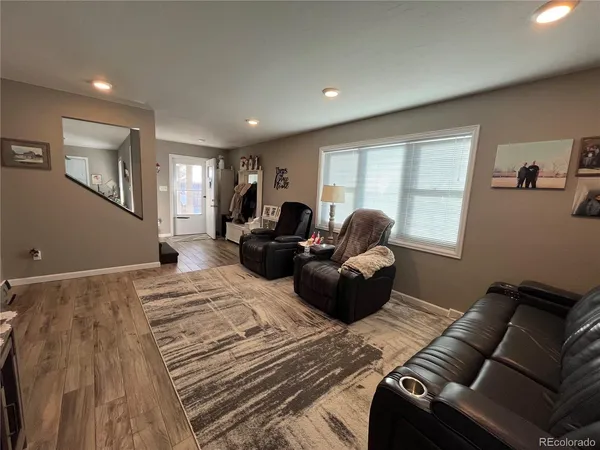 a living room with furniture window and a couch