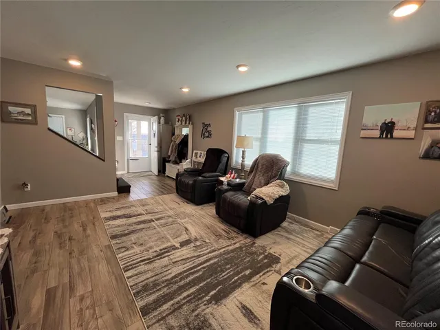 a living room with furniture window and a couch