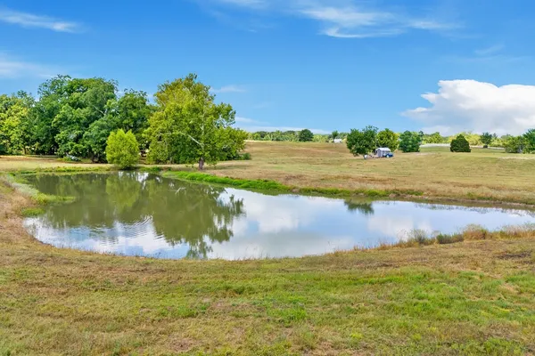 a view of a lake with a big yard