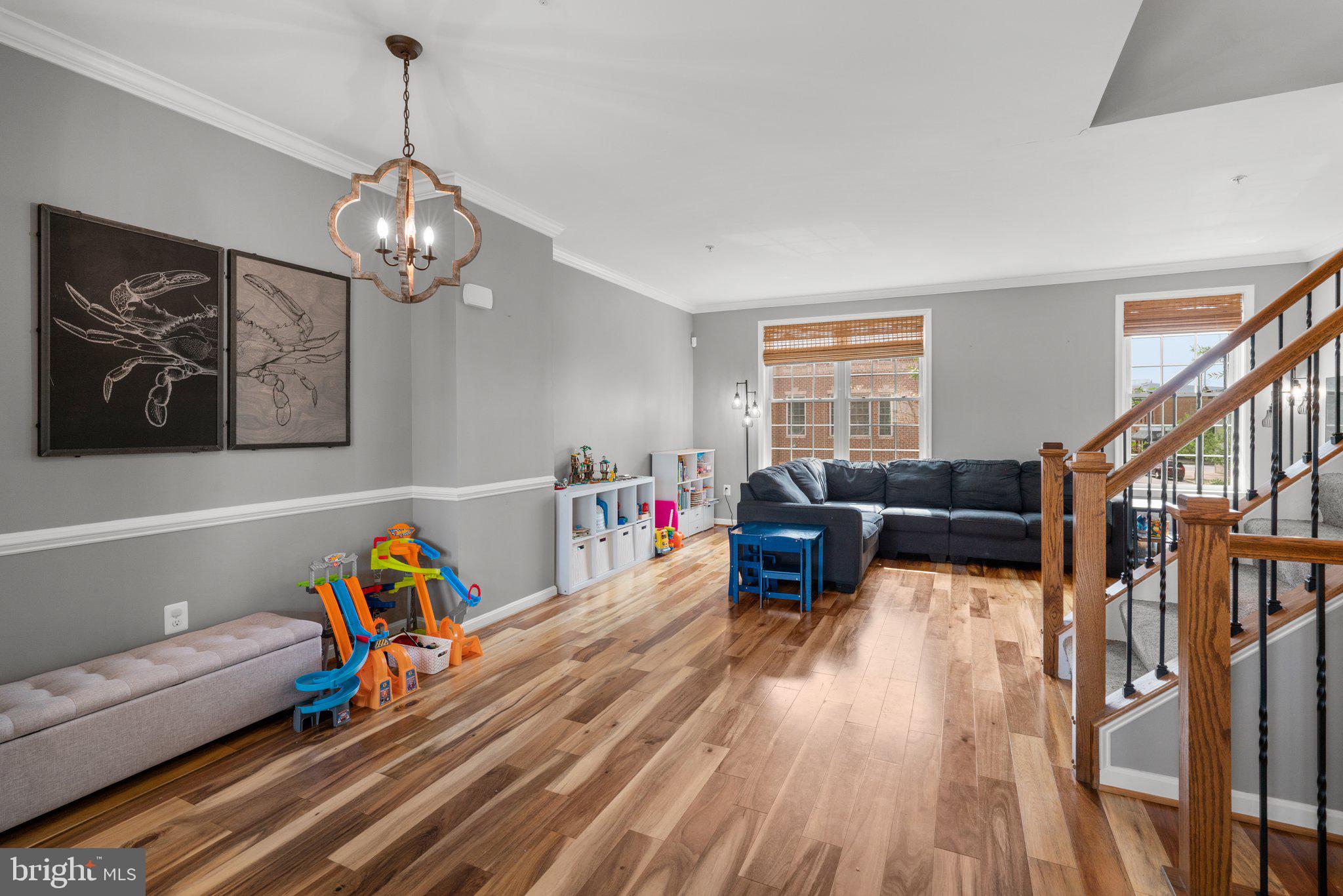 1338 Lowman Street Baltimore, MD 21230 - Photo 24 of 72 a living room with furniture kitchen view and a wooden floor