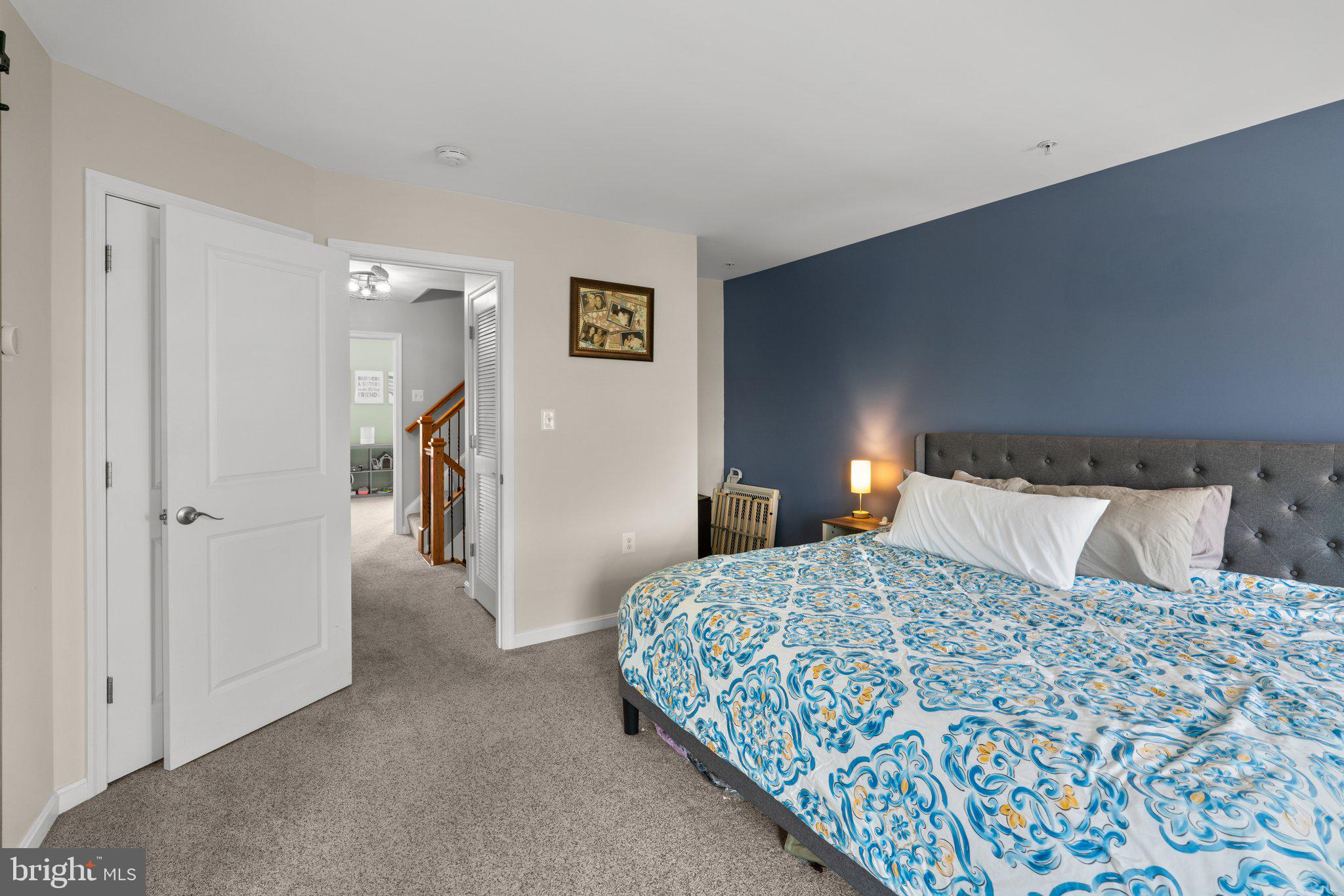 1338 Lowman Street Baltimore, MD 21230 - Photo 34 of 72 a bedroom with a bed and a lamp