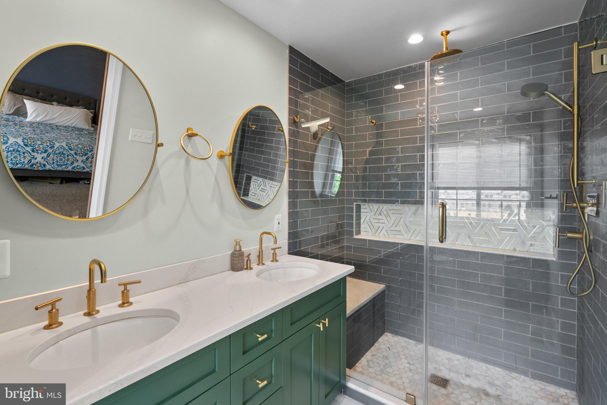 1338 Lowman Street Baltimore, MD 21230 - Photo 35 of 72 a bathroom with a double vanity sink mirror and shower