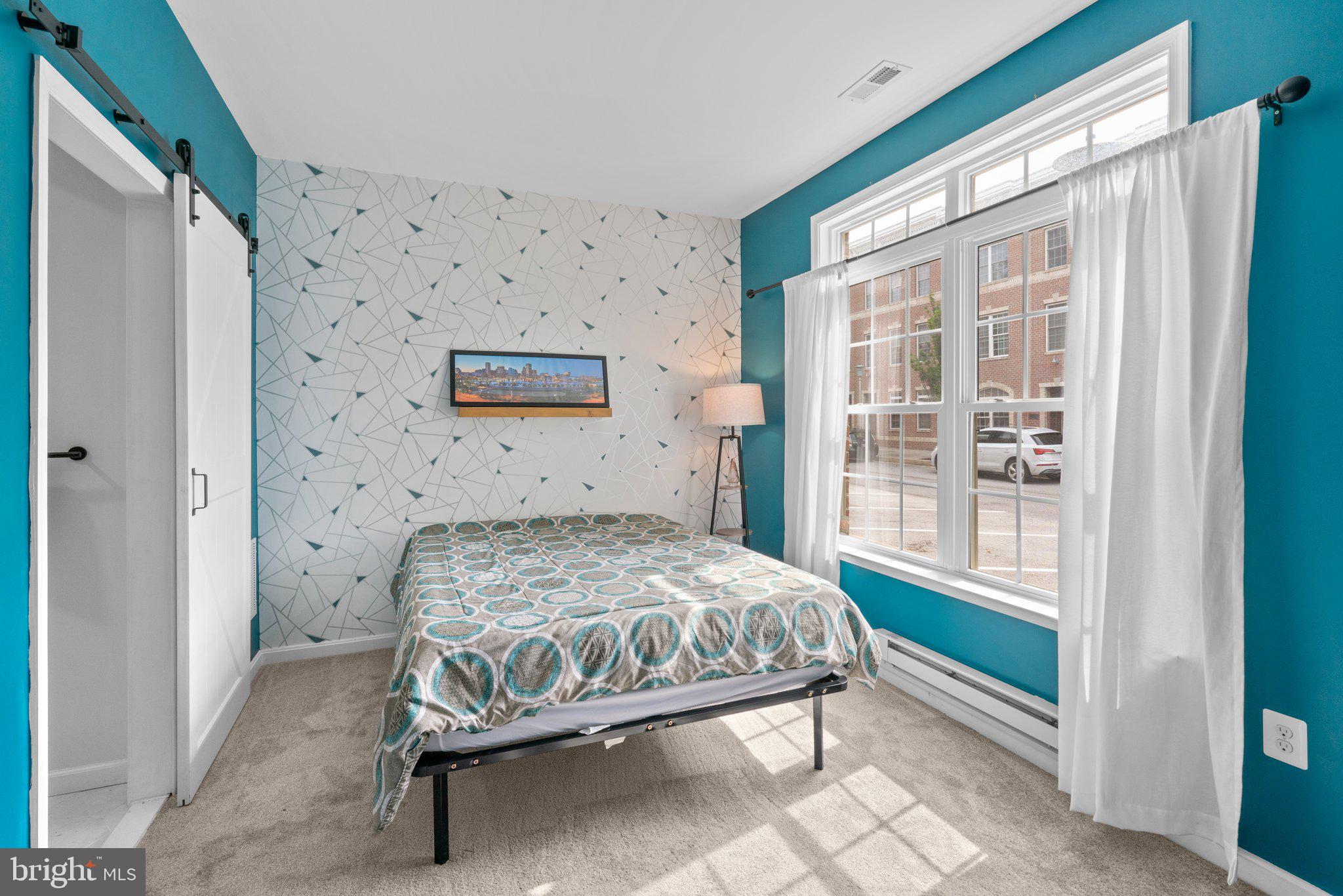 1338 Lowman Street Baltimore, MD 21230 - Photo 4 of 72 a bedroom with a bed and a window