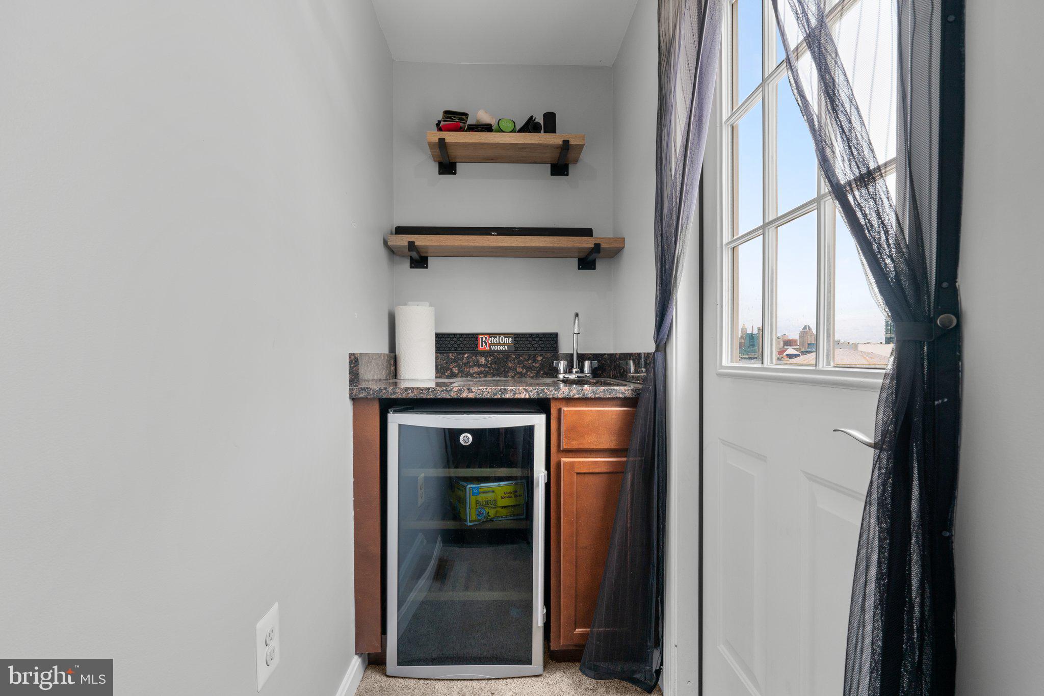 1338 Lowman Street Baltimore, MD 21230 - Photo 44 of 72 a kitchen with a refrigerator and a window