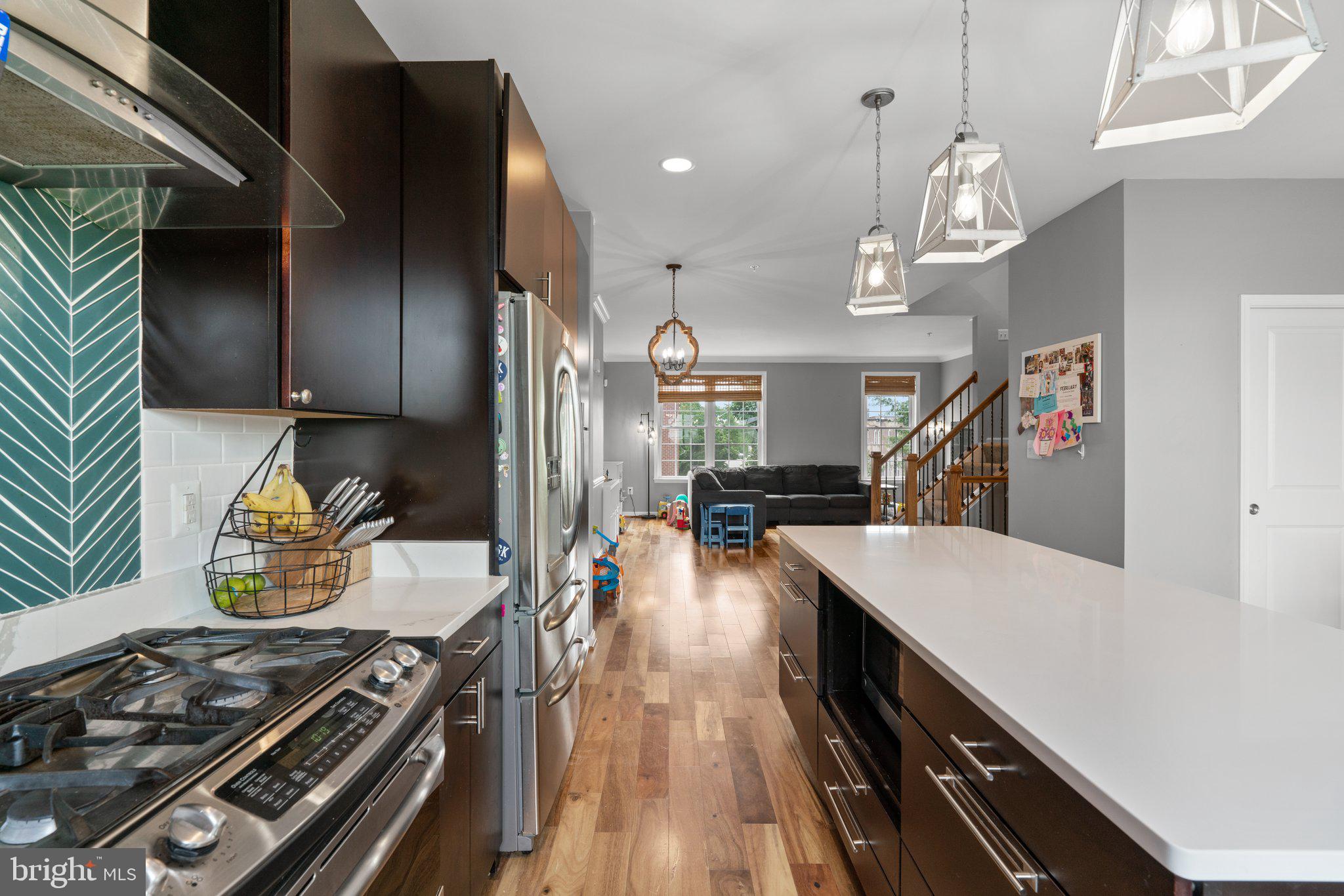 1338 Lowman Street Baltimore, MD 21230 - Photo 10 of 72 a kitchen with stove and a wooden floor