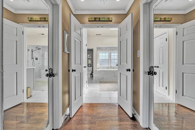 a spacious bathroom with a tub and shower