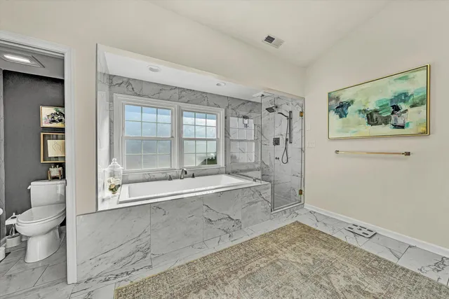a spacious bathroom with a double vanity sink and a mirror