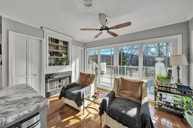 a kitchen with stainless steel appliances kitchen island granite countertop a stove microwave and cabinets