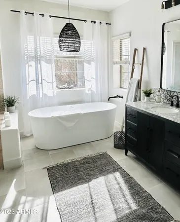 a spacious bedroom with a bed and a table