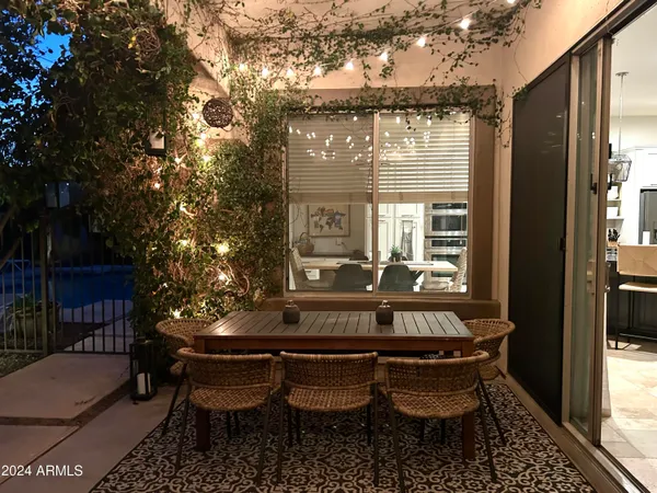 a view of a tennis court with sitting area