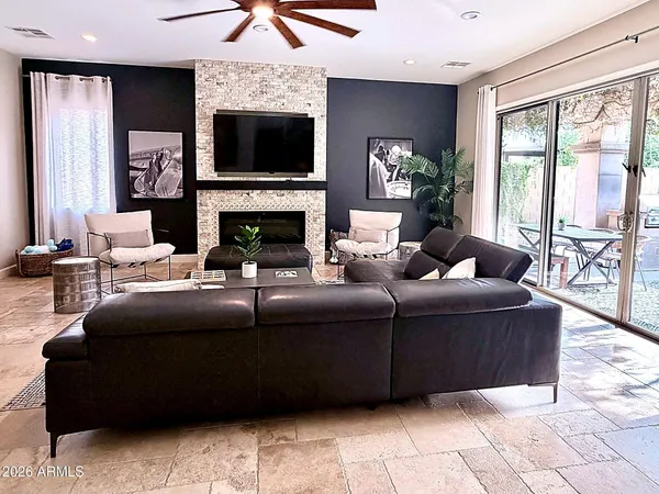 a view of a dining room with furniture wooden floor and chandelier