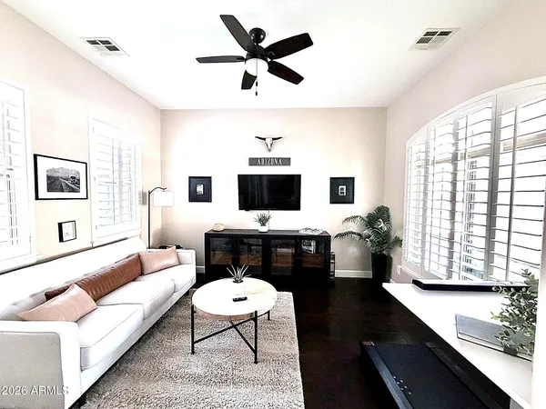 a bathroom with a sink mirror vanity and toilet