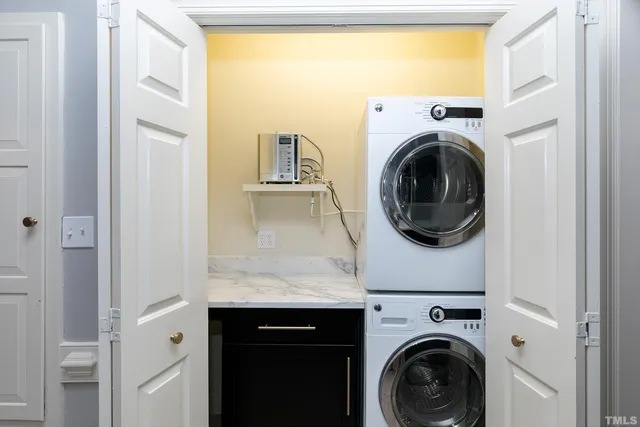 a view of a livingroom with wooden floor and a window