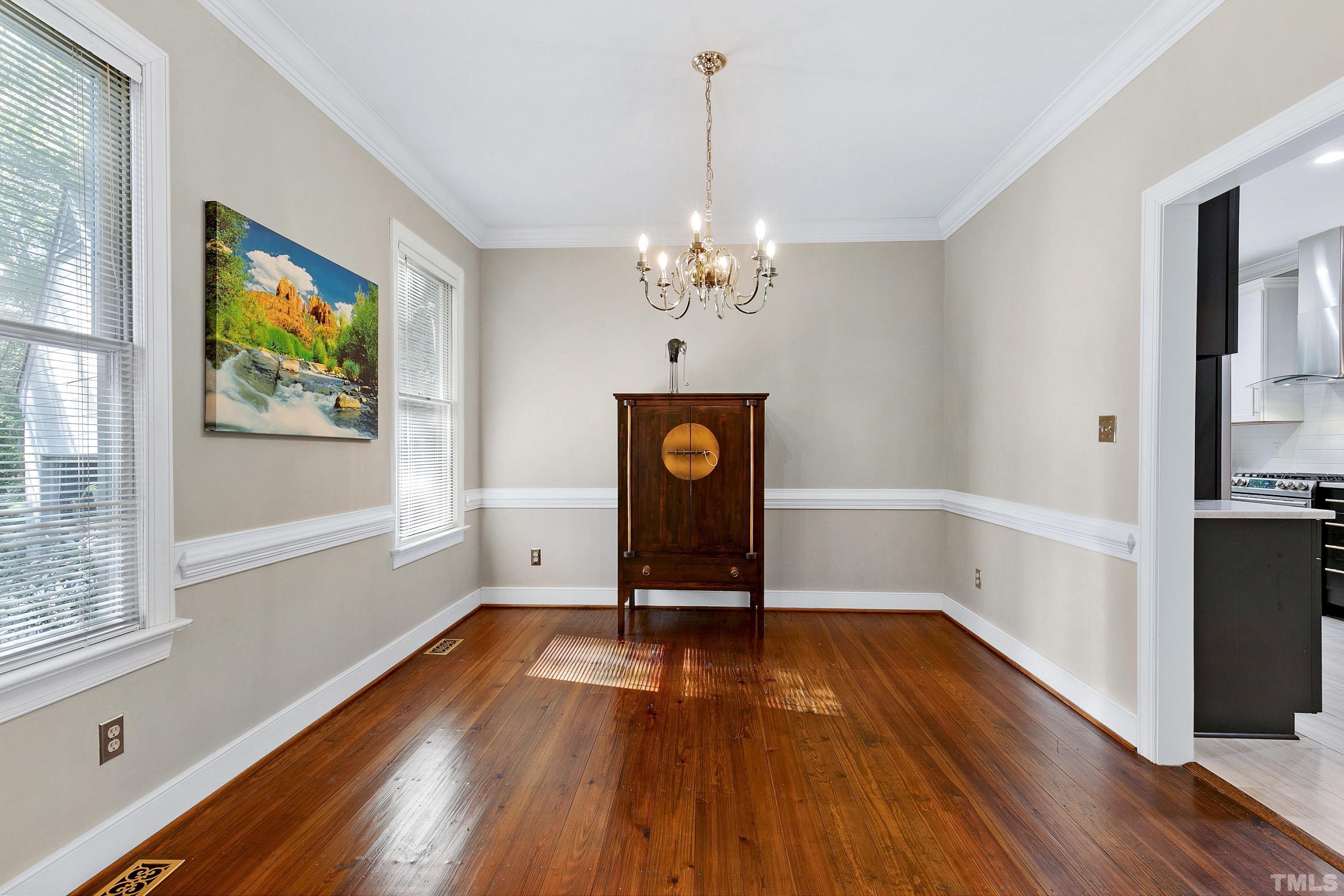 113 Palace Green Cary, NC 27518 - Photo 12 of 32 a view of a livingroom with wooden floor and a window